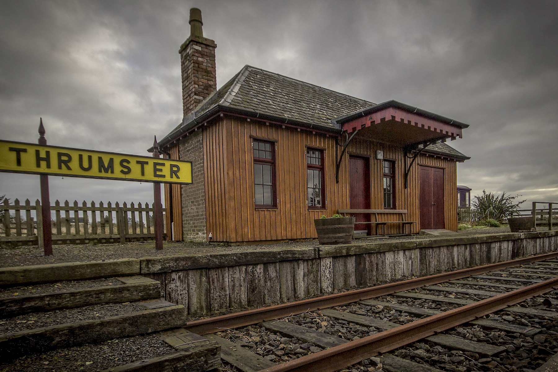 Thrumster image: Single platform train station with small wooden platform house.