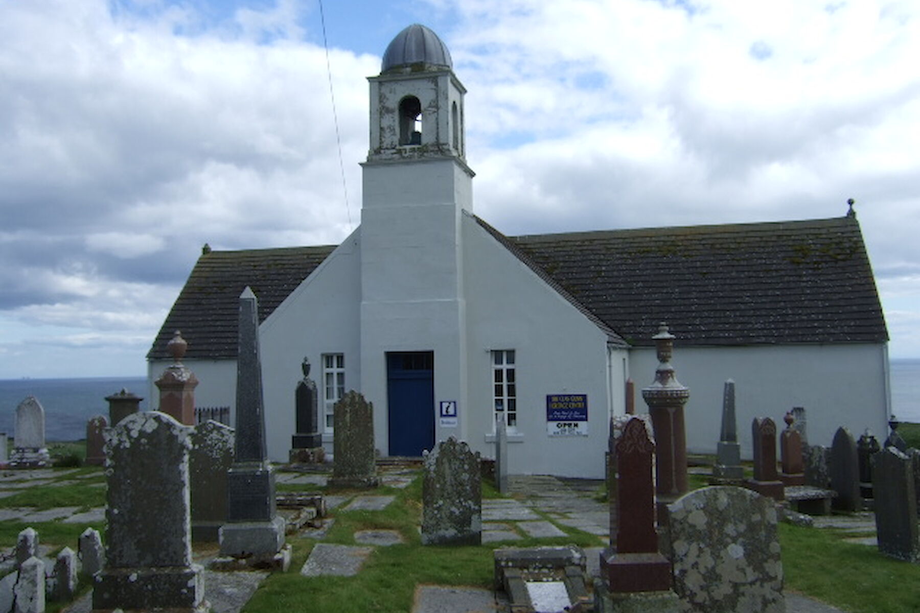 Latheron image: Church with belltower and graveyard