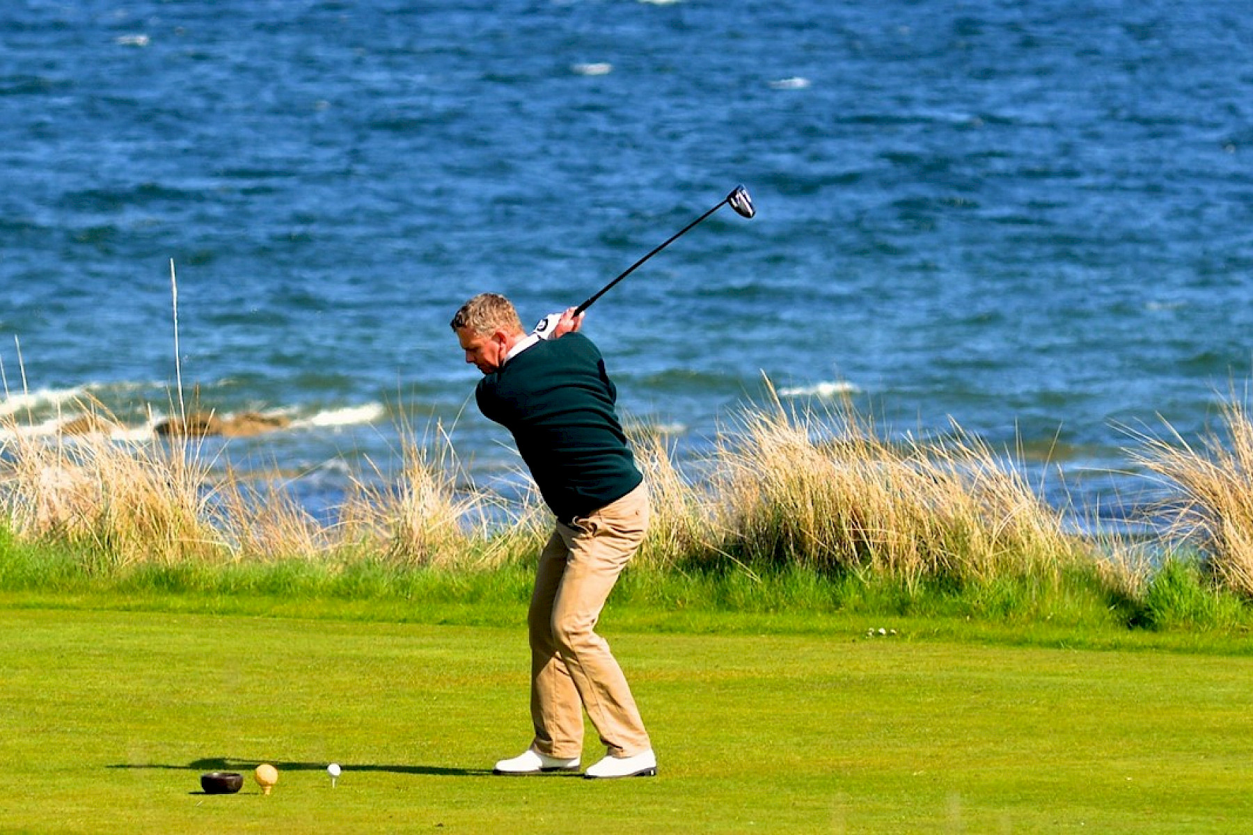 Dornoch image: Golfer takes a swing