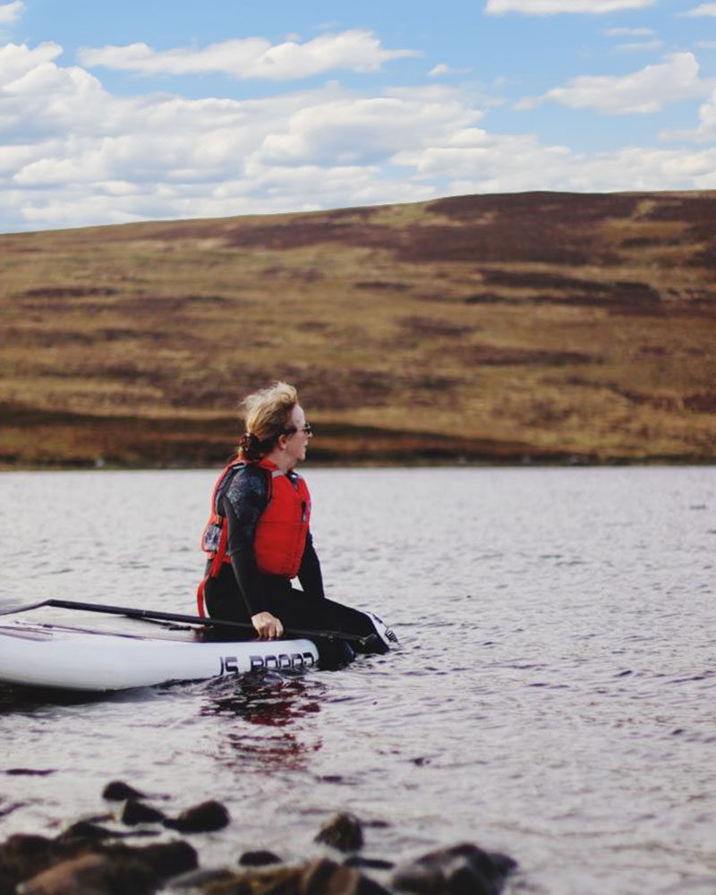 Paddleboarder on Loch Buidhe, Central Sutherland