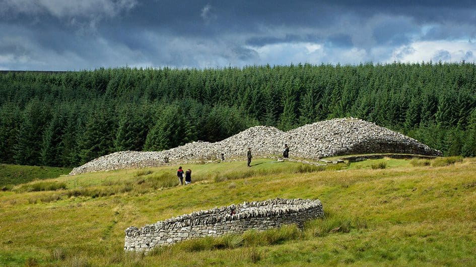 Visitors enjoyng the history at the Grey Cairns of Camster, Caithness, near the NC500.