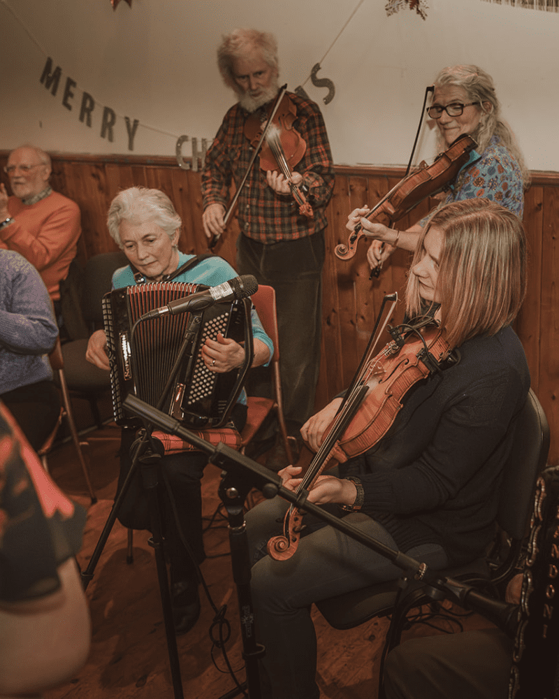 Band playing traditional Scottish fiddles and accordian at Doll Hall Ceilidh, Sutherland Sessions, North Highlands