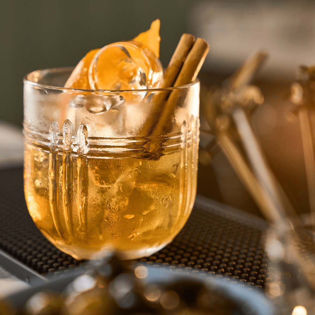 A festive looking drink with a stick of cinnamon and curl of orange peel to garnish, Highland Coast Hotels, East Sutherland, North Highlands