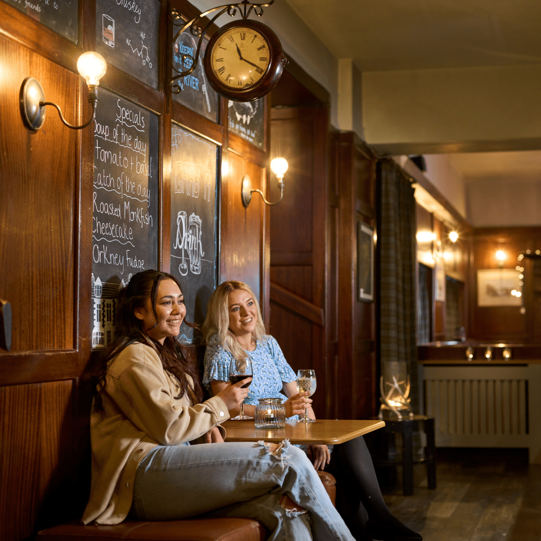 Two ladies having a drink in the bar at the Ulbster Arms Hotel, Halkirk, Caithness, North Highlands. Places to eat and drink North Highlands