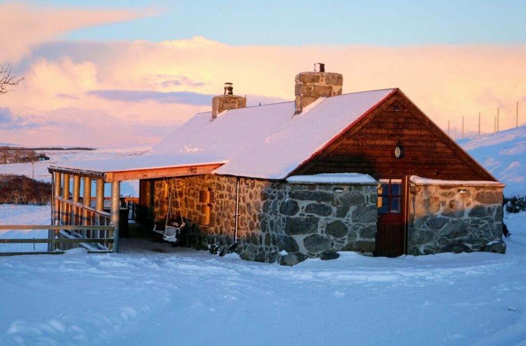 A cottage covered in snow in Sutherland, North Highlands