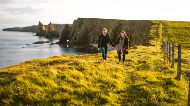 Couple on romantic walk at Duncansby Stacks, North Coast 500, Caithness, Highlands