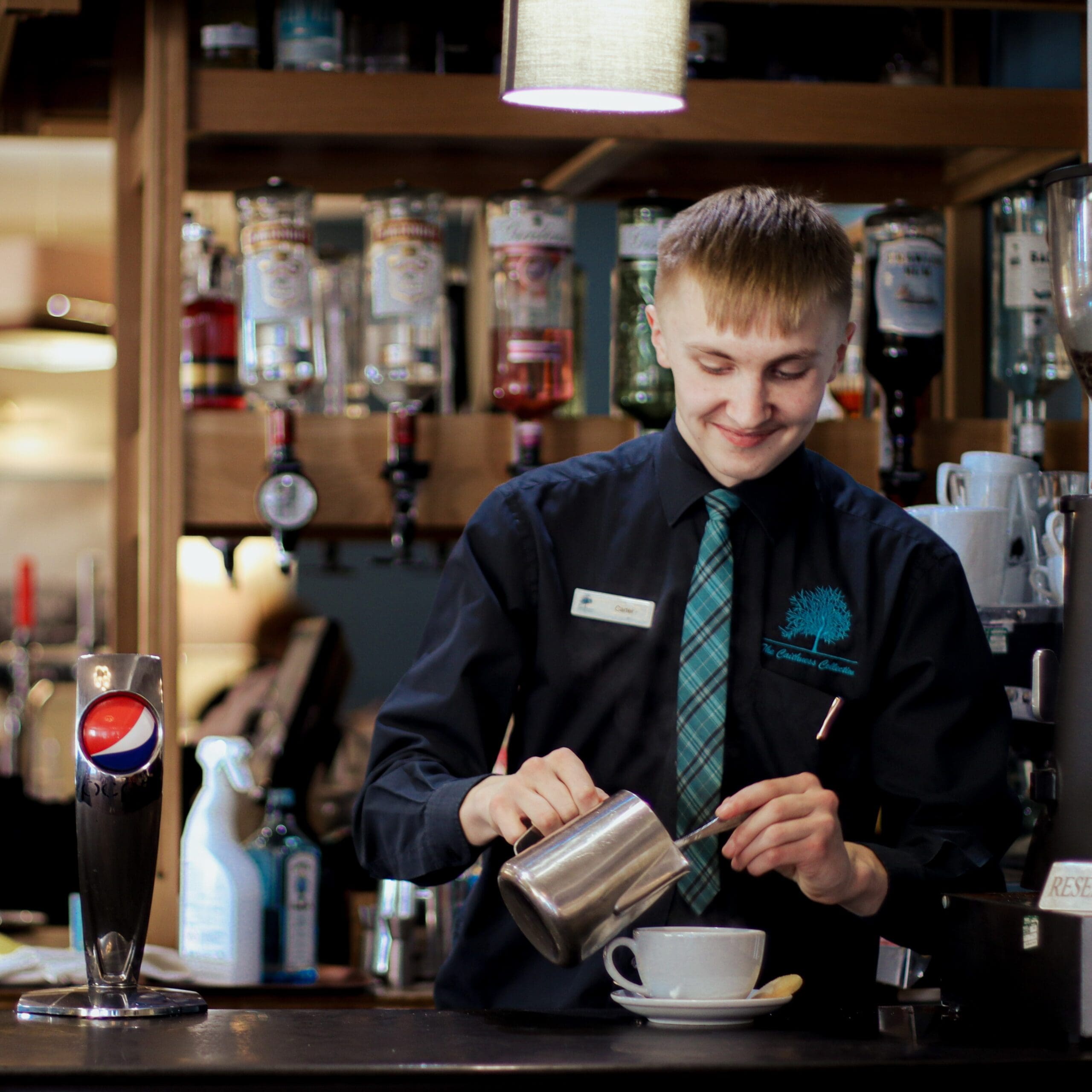 Bartender at The Norseman Hotel pours a coffee, Hotels and Resteraunts in Wick, Caithness, North Highlands