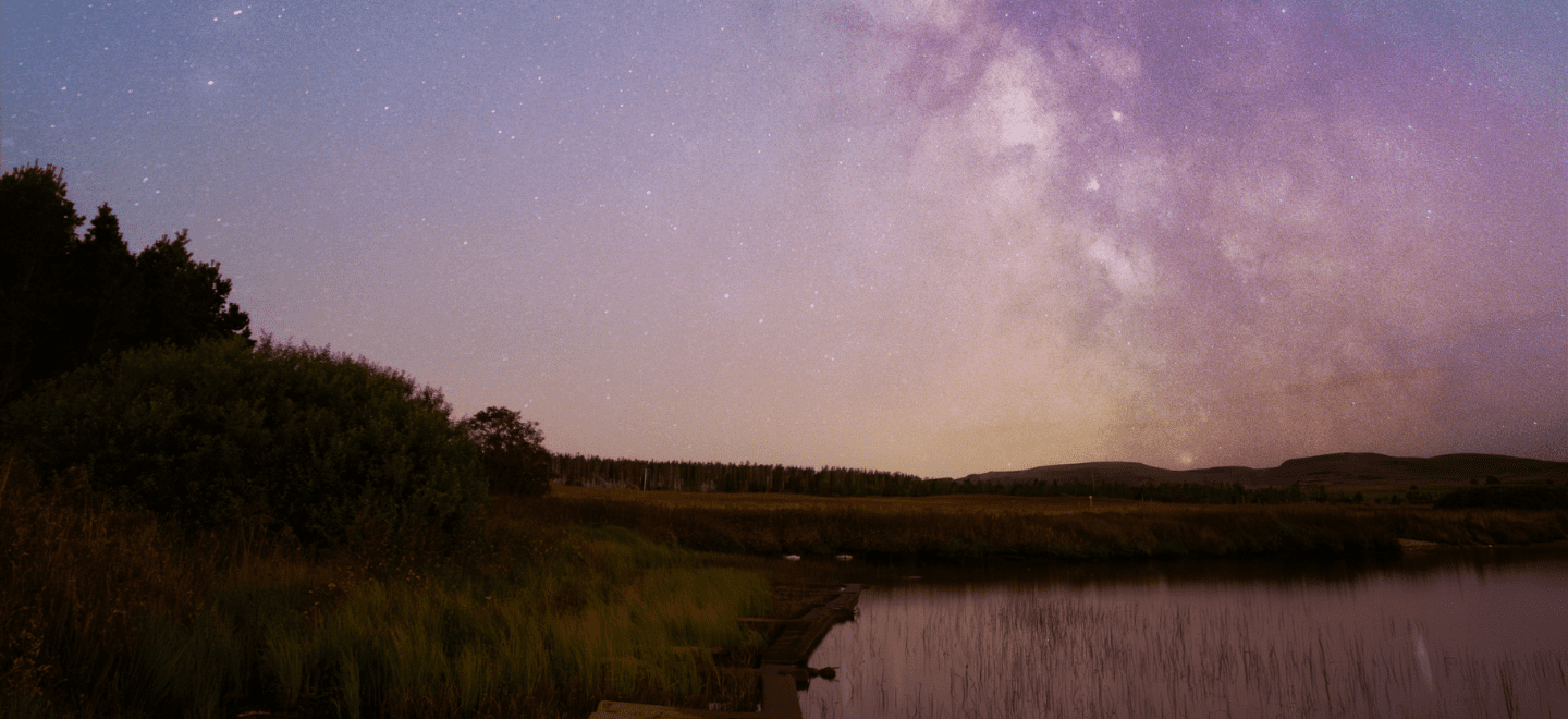 A scene of the night sky in the North Highlands, the galaxy can be seen streaking across the sky.
