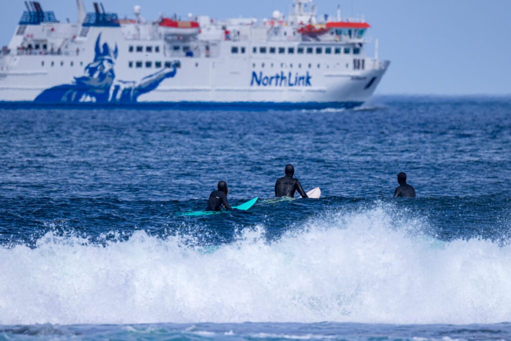 Surfers at Thurso East, Caithness, North Coast 500