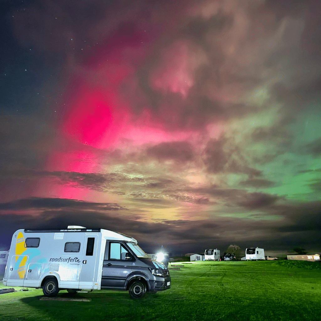Aurora borealis over a campervan at Dornoch Caravan and camp Site near North Coast 500