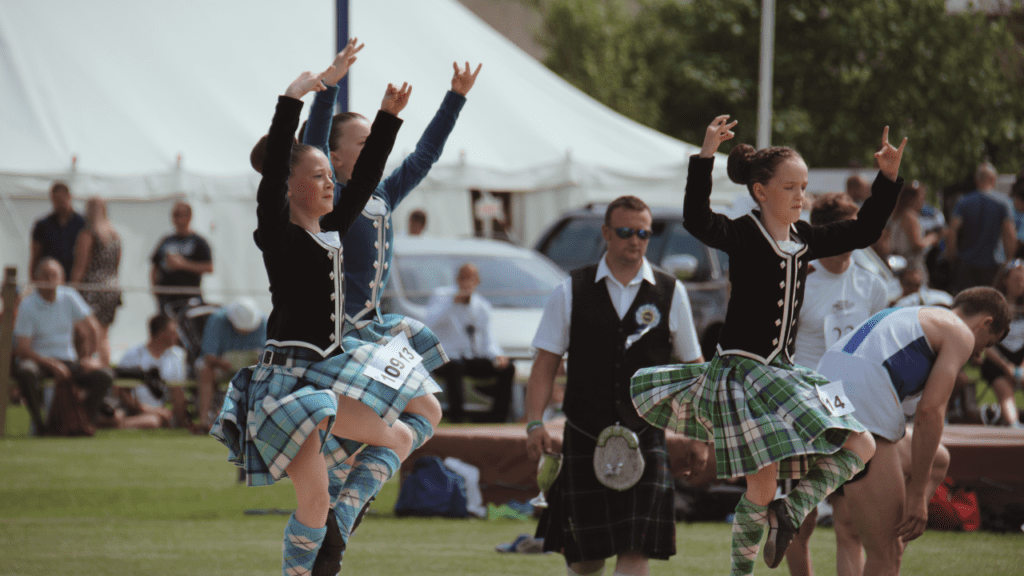 Three Highland Dancers performing at the Halkirk Games, in Caithness, Scotland