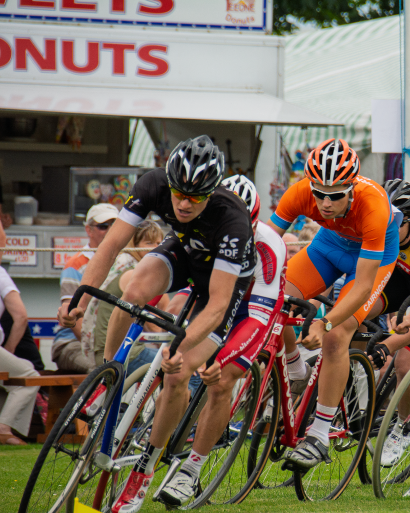 Two cyclists in a race at the Halkirk Games, Halkirk, North Highlands