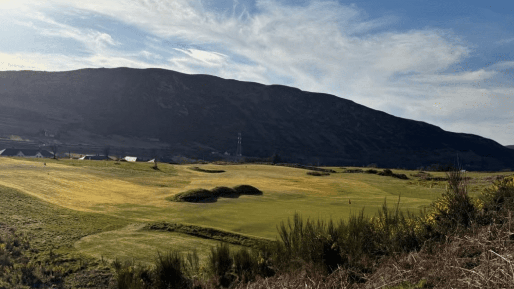 A view across the Helmsdale Golf course, with a hill in the background, in Sutherland, north Highlands