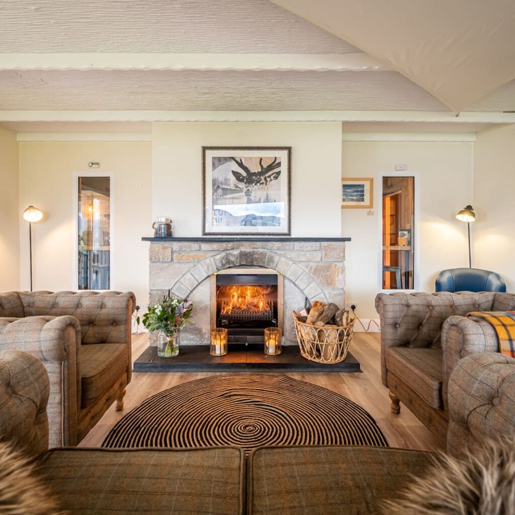 A cosy roaring fire in the luxury sitting area of Newton Lodge Hotel, North West Sutherland on North Coast 500, Highlands