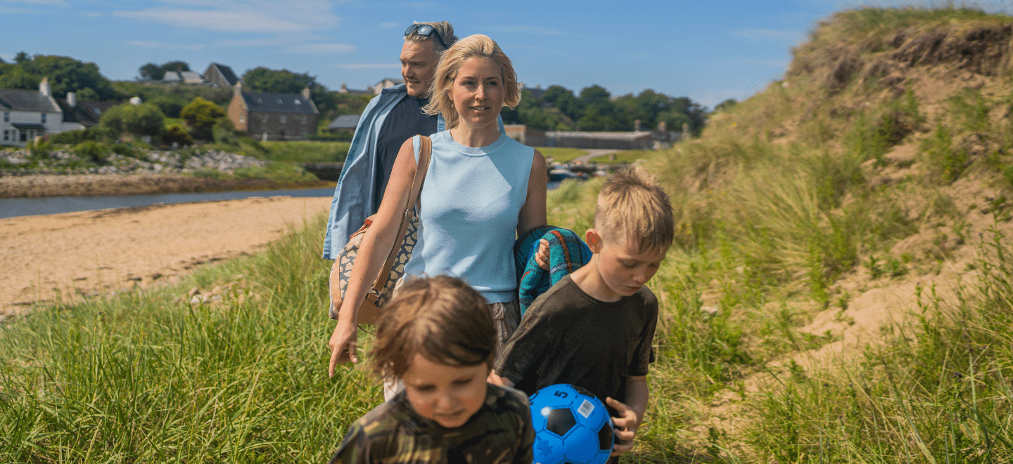 A family enjoying a day out together on Brora Beach in the North Highlands