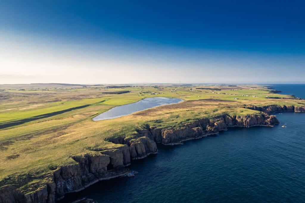 An aerial view of Sarclet Loch, a popular fishing loch, in Caithness, along the North Coast 500