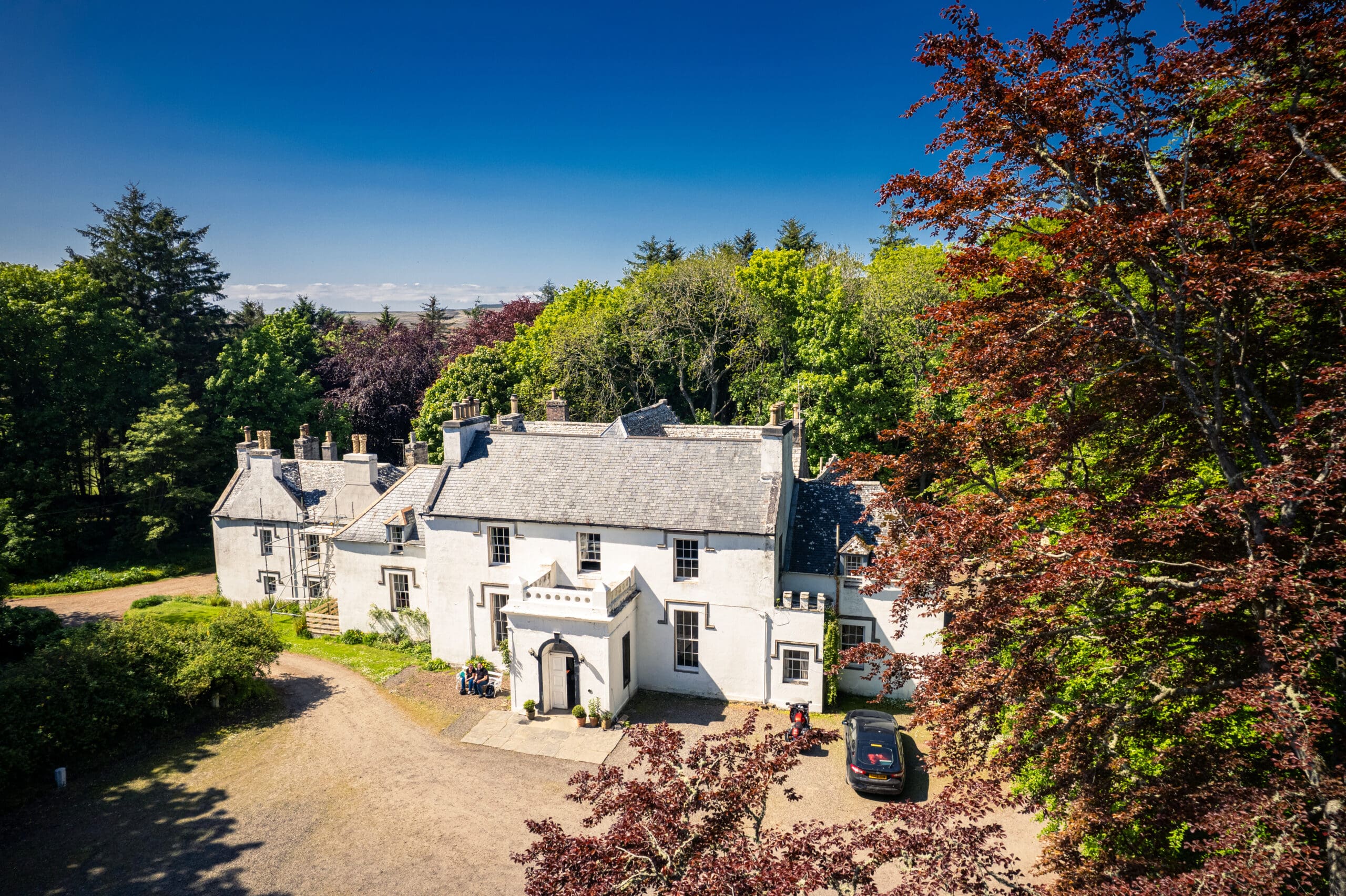 An aerial shot of Thrumster House B&B, showing the main house located in Thrumster, North Highlands, along the NC500