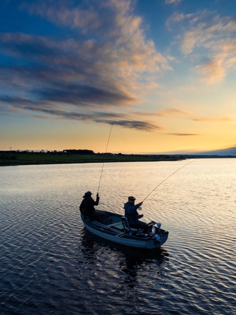 Two fisherman on Yarrows Loch, a popular fishing Loch near Thrumster, along the North Coast 500