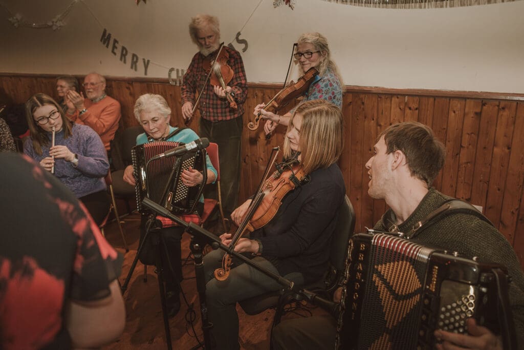 Band playing traditional Scottish fiddles and accordian at Doll Hall Ceilidh, Sutherland Sessions, North Highlands