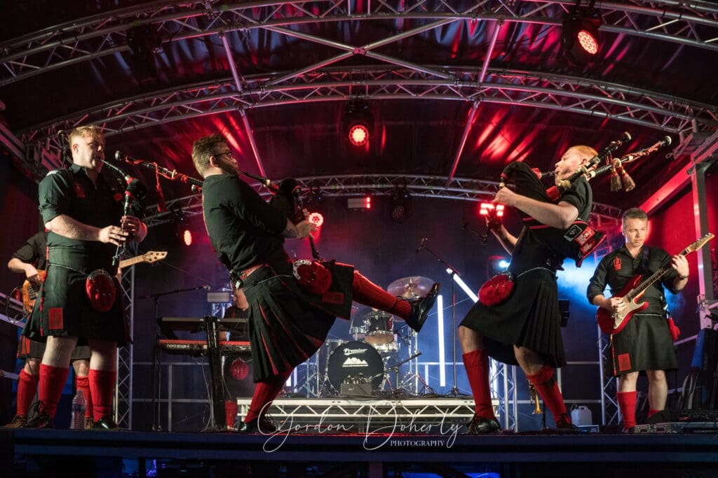 Red Hot Chilli Pipers playing live rock celtic music at the Dornoch Beer Festival North Highland Summer Event