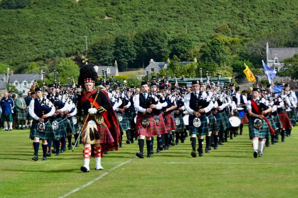 Mass Pipe Bands Parade at Helmsdale Highland Games